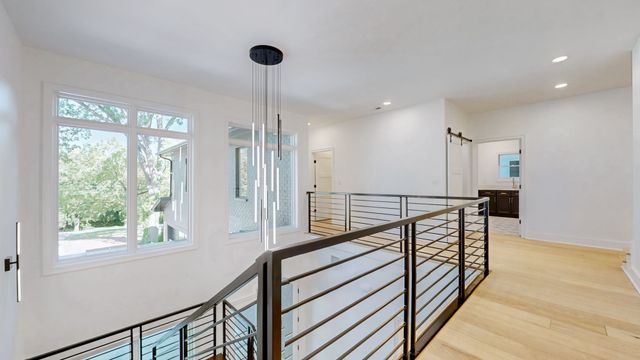 an aerial view of a house with a yard basket ball court and outdoor seating