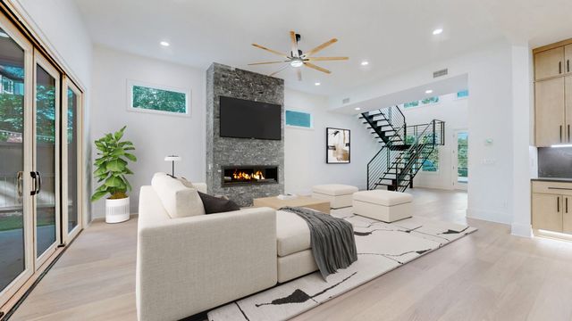 a view of a kitchen with a sink and a refrigerator