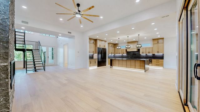 a view of a livingroom with a ceiling fan and a window