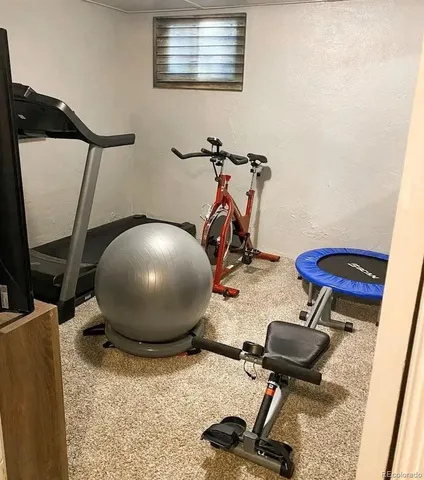 a view of backyard with a chair under an umbrella