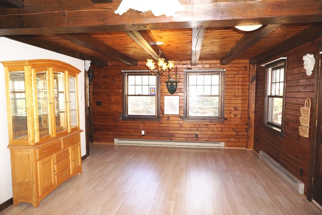 63 Breakneck Road Sturbridge, MA 01566 - Photo 16 of 30 a view of an empty room with wooden floor and a window