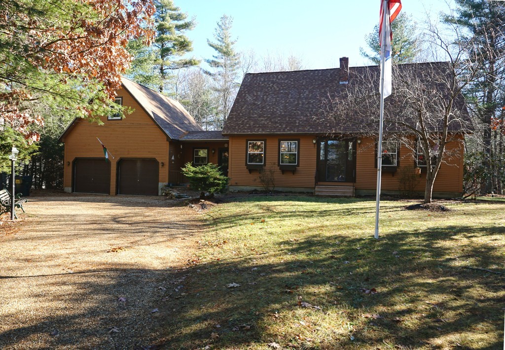 63 Breakneck Road Sturbridge, MA 01566 - Photo 2 of 30 a house that has a tree in front of it