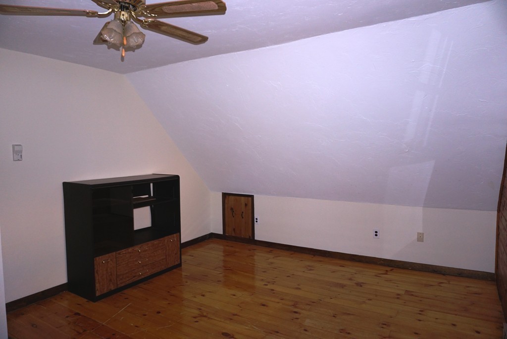 63 Breakneck Road Sturbridge, MA 01566 - Photo 26 of 30 a view of an empty room with a ceiling fan