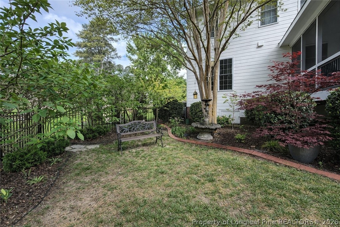14 Spring Water Court Spring Lake, NC 28390 - Photo 28 of 34 a view of a chair and table in backyard of the house