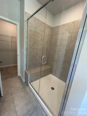 a bathroom with a tub and shower