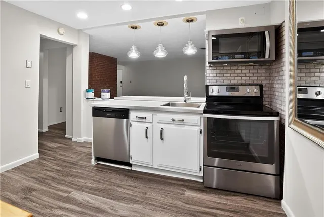 a kitchen with a stove and a microwave