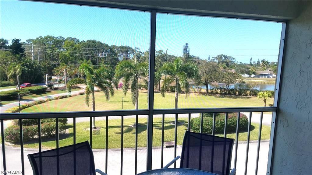 1075 Foxfire Lane, Unit 309 Naples, FL 34104 - Photo 12 of 33 a view of outdoor space with swimming pool