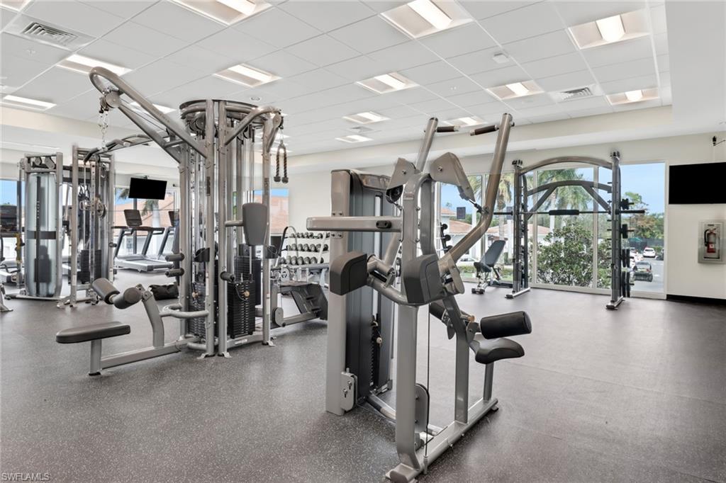 1075 Foxfire Lane, Unit 309 Naples, FL 34104 - Photo 25 of 33 a view of a room with gym equipment