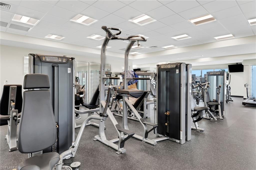 1075 Foxfire Lane, Unit 309 Naples, FL 34104 - Photo 26 of 33 a view of a room with gym equipment