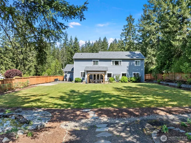 a front view of a house with a garden