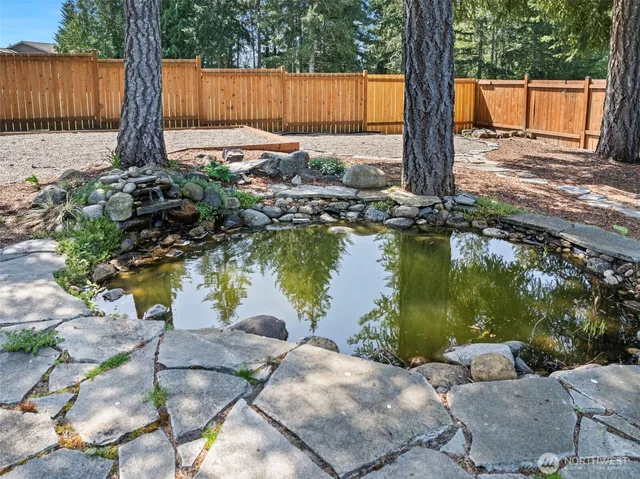 a view of a lake with a floor to palm trees