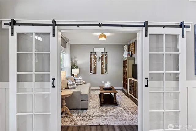 a living room with furniture and a rug