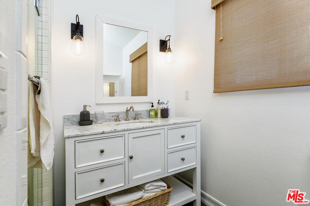 45 Paradise Cove Road Malibu, CA 90265 - Photo 12 of 15 a bathroom with a sink and a mirror