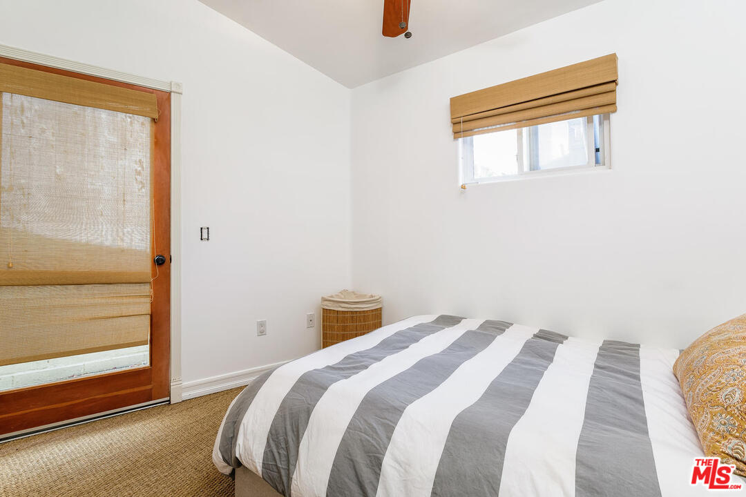 45 Paradise Cove Road Malibu, CA 90265 - Photo 10 of 15 a bedroom with a bed and a window