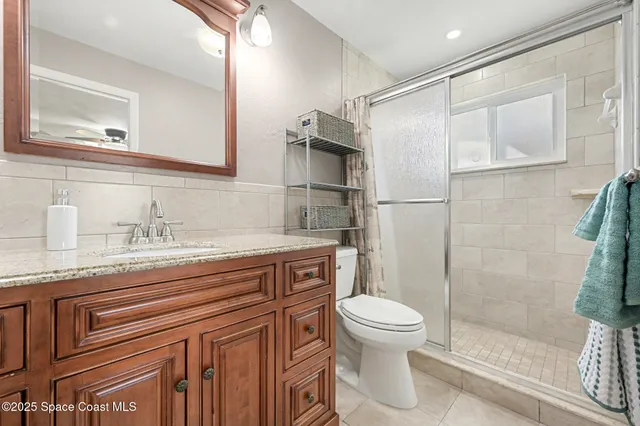 a view of a porch with furniture and garden