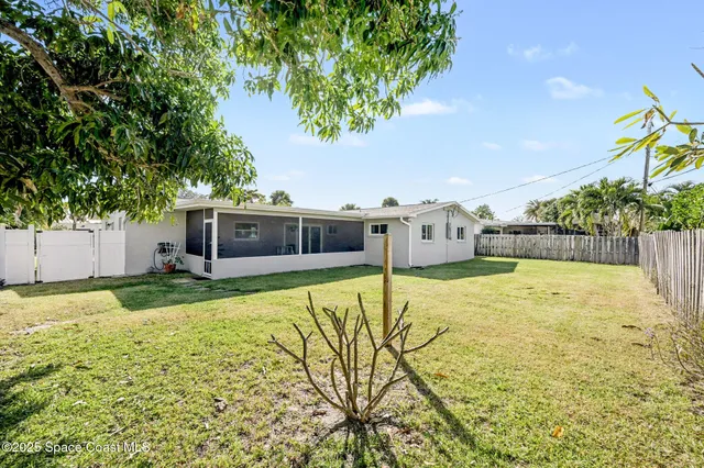 a swimming pool with trees in the background
