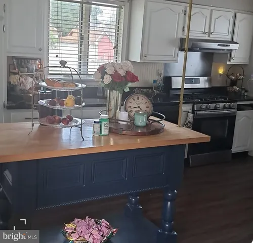 a kitchen with a sink cabinets and window