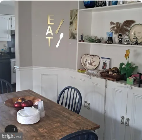 a table with a vase and flowers on it