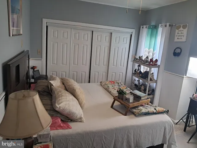 a bedroom with furniture and a wooden floor