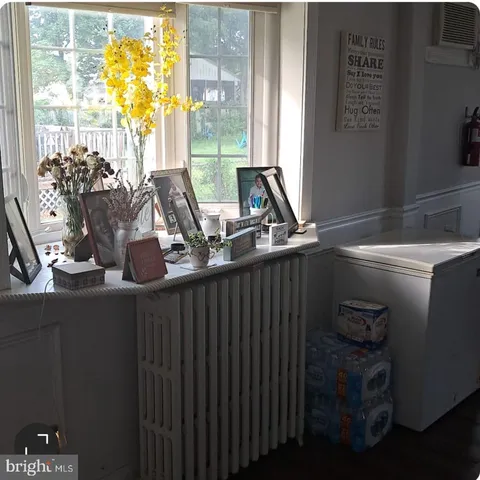 a bathroom with a double vanity sink and a large mirror
