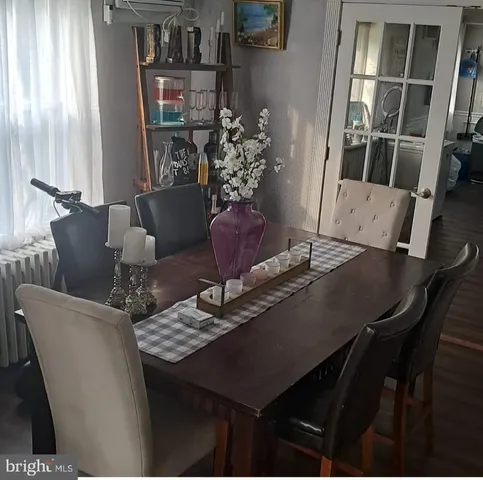a view of a dining room with furniture and window