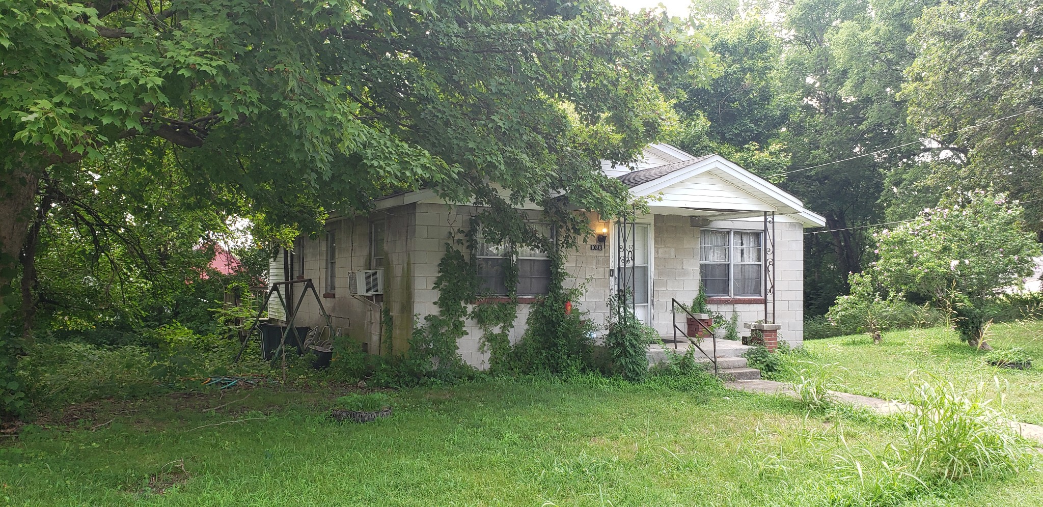 1026 Pepper Street Springfield, TN 37172 - Photo 2 of 2 a front view of a house with garden