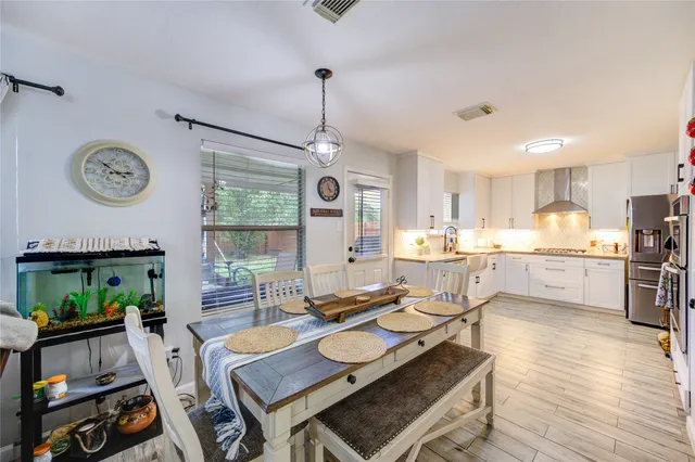 a living room with kitchen island furniture and a window
