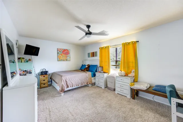 a bedroom with furniture and a window