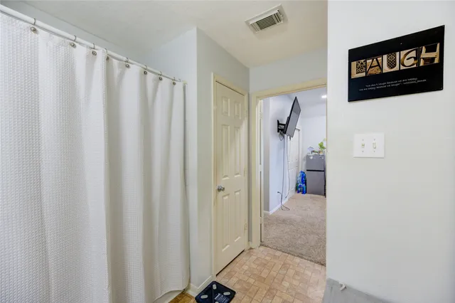 a bed room with a bed and a chandelier