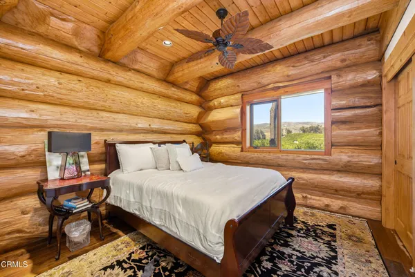 a bed room with a bed and a large window