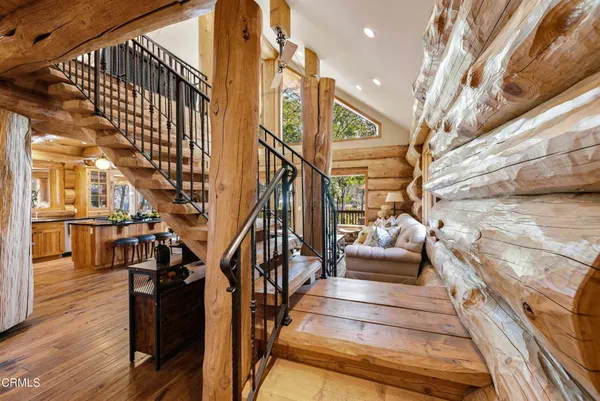 a view of a balcony with wooden floor and fence