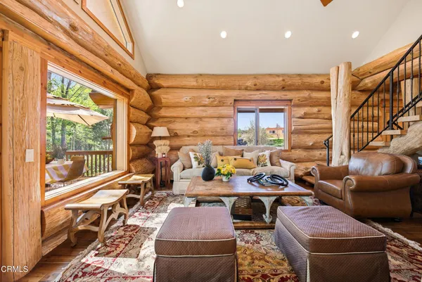 a kitchen with stainless steel appliances granite countertop a sink a stove and a wooden floors