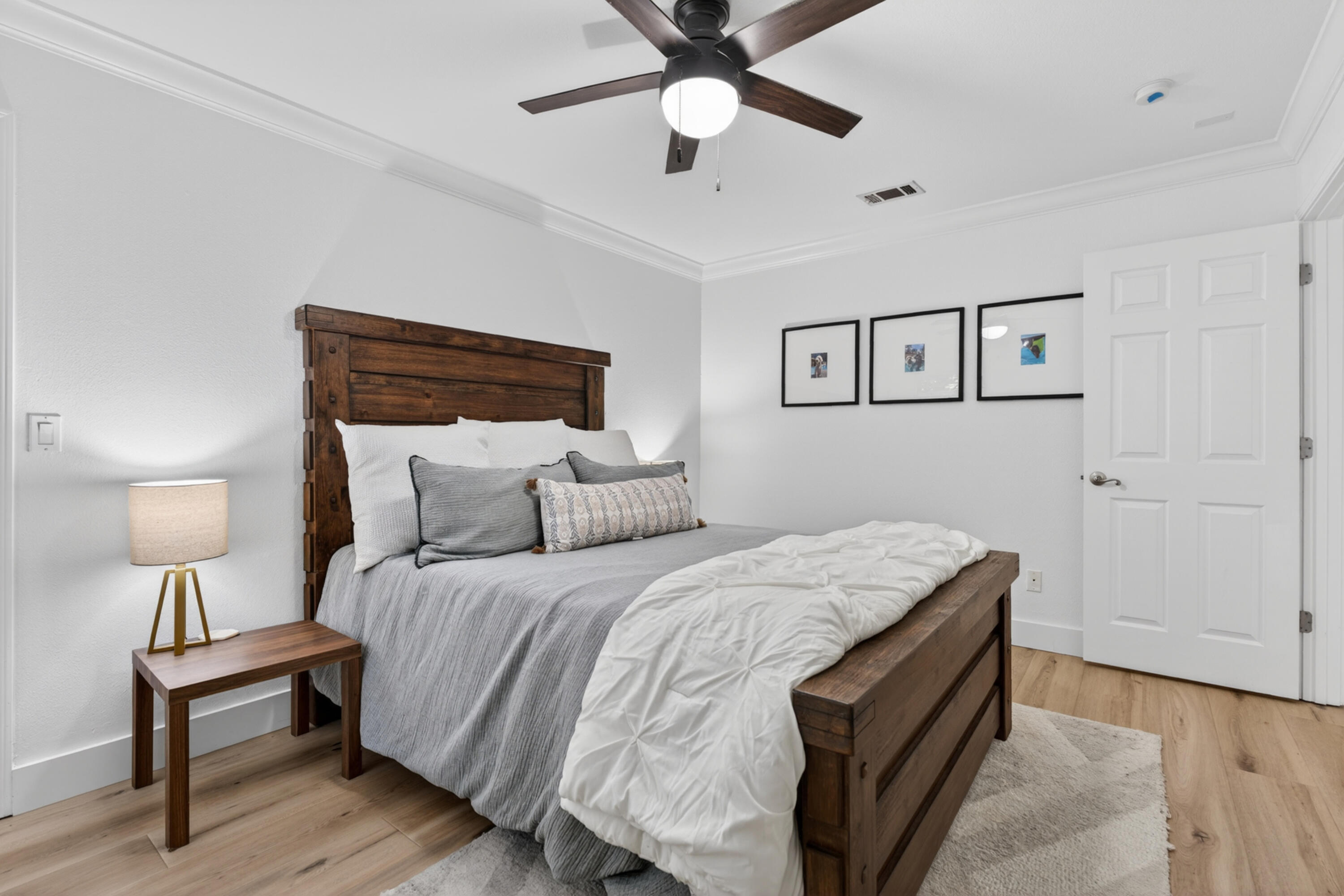 209 Santa Barbara Avenue Santa Rosa Beach, FL 32459 - Photo 22 of 78 a bedroom with a bed and a lamp on a dresser