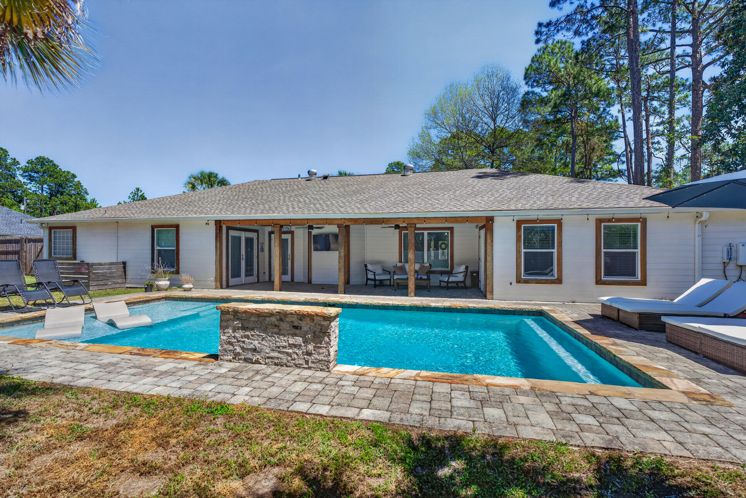 209 Santa Barbara Avenue Santa Rosa Beach, FL 32459 - Photo 48 of 78 a view of a house with swimming pool and a yard