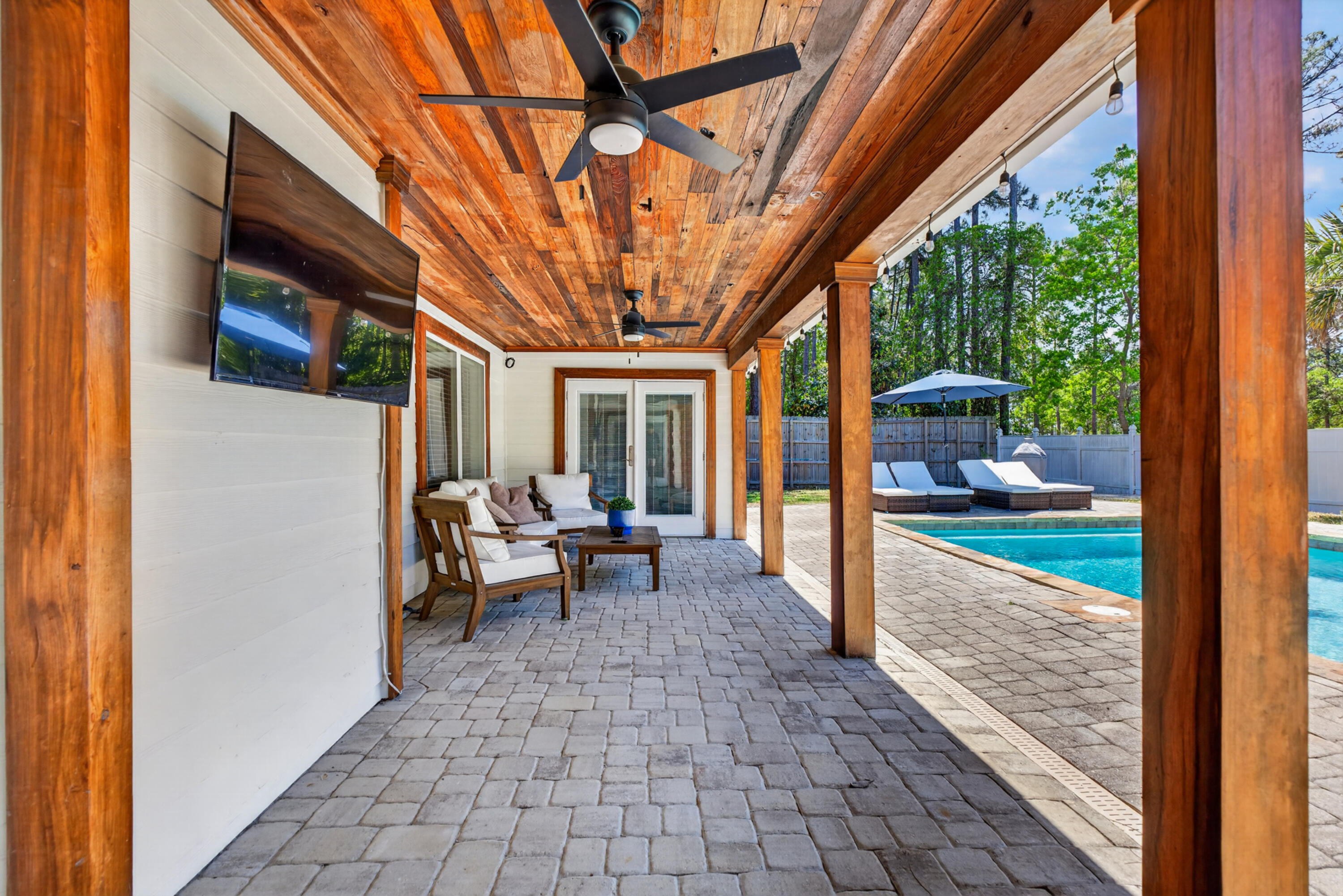 209 Santa Barbara Avenue Santa Rosa Beach, FL 32459 - Photo 50 of 78 a view of a porch with chairs and backyard