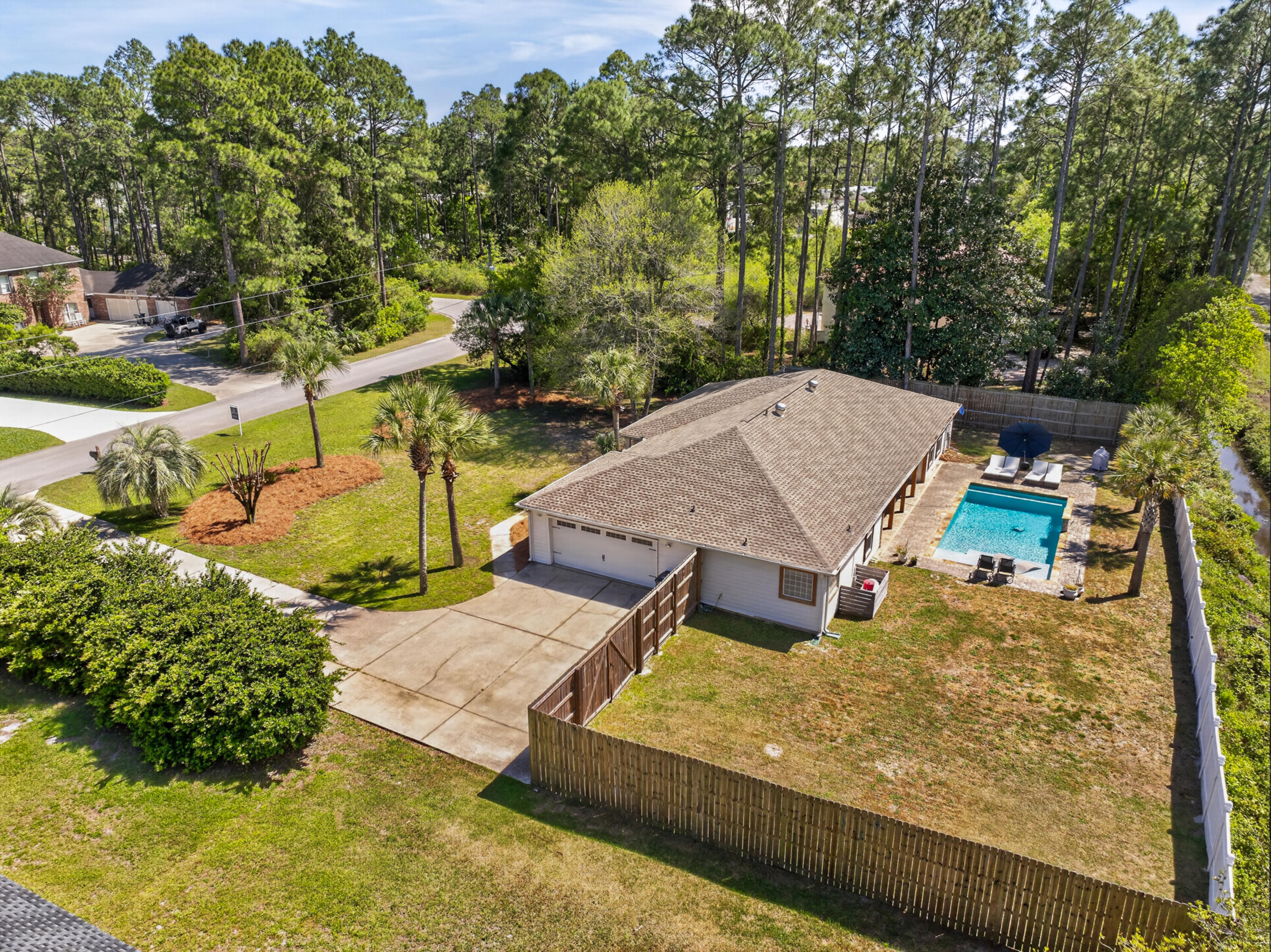 209 Santa Barbara Avenue Santa Rosa Beach, FL 32459 - Photo 65 of 78 aerial view of a house with swimming pool and sitting area