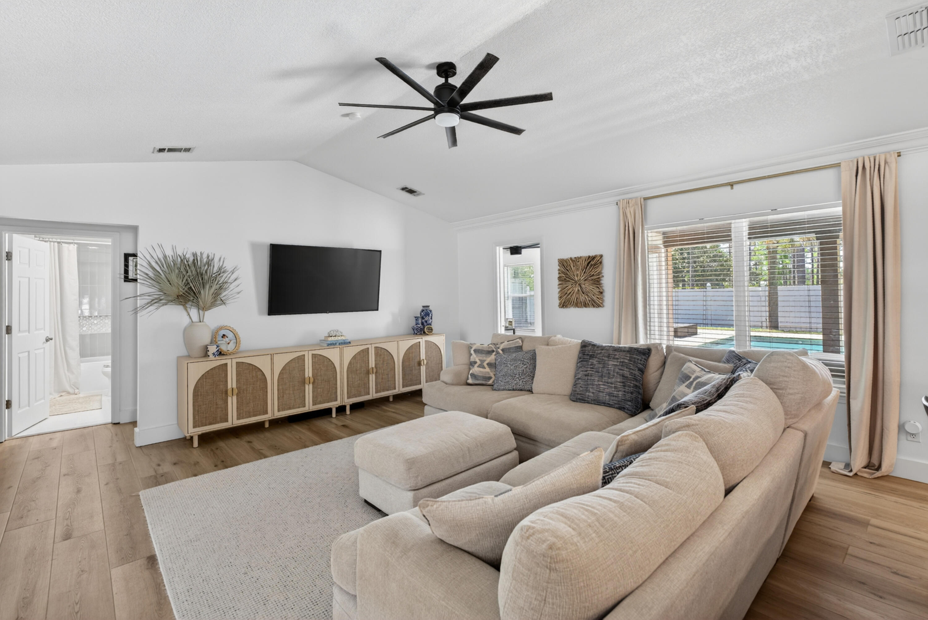 209 Santa Barbara Avenue Santa Rosa Beach, FL 32459 - Photo 7 of 78 a living room with furniture and a flat screen tv