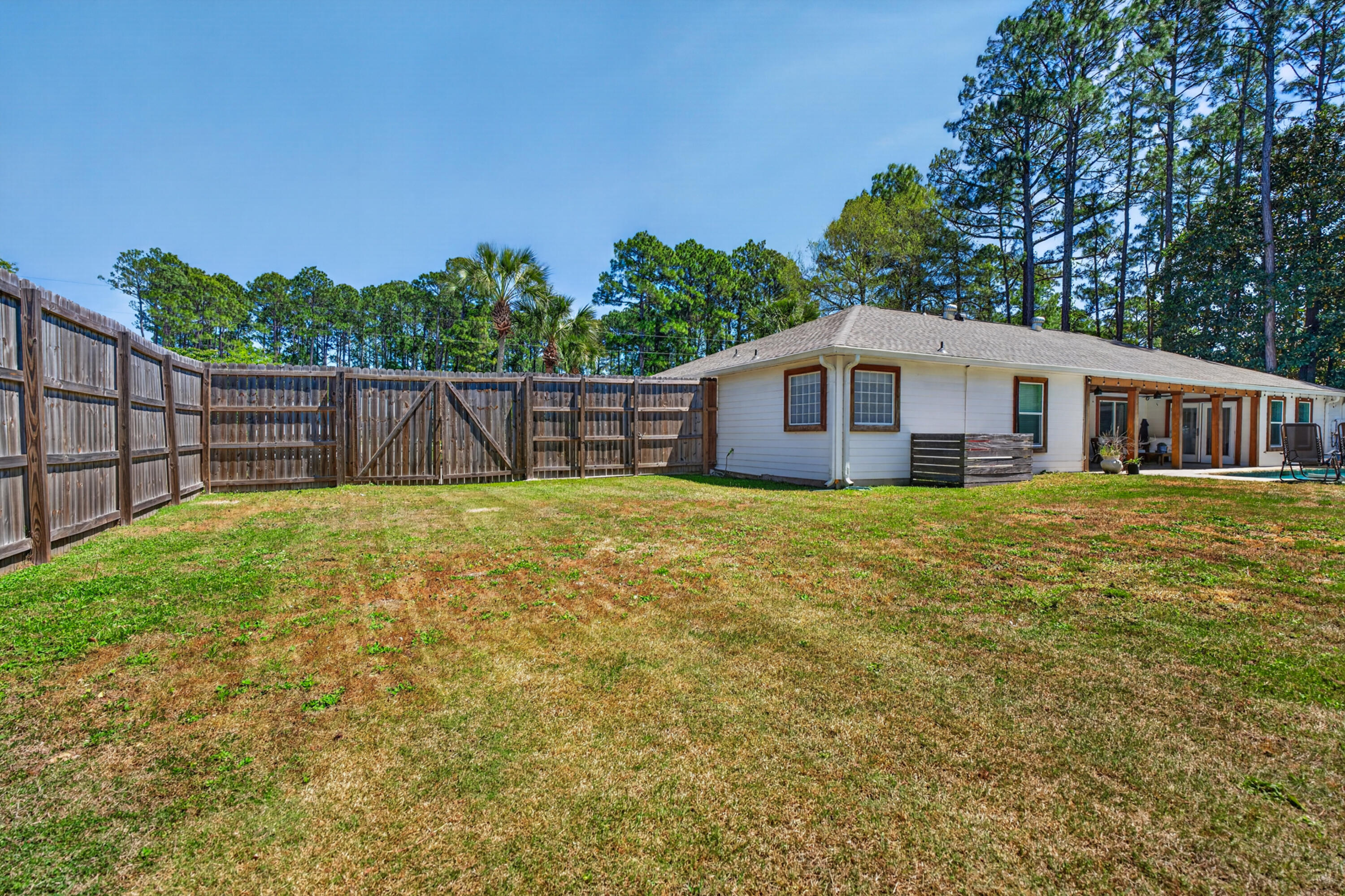 209 Santa Barbara Avenue Santa Rosa Beach, FL 32459 - Photo 71 of 78 a view of a house with a backyard