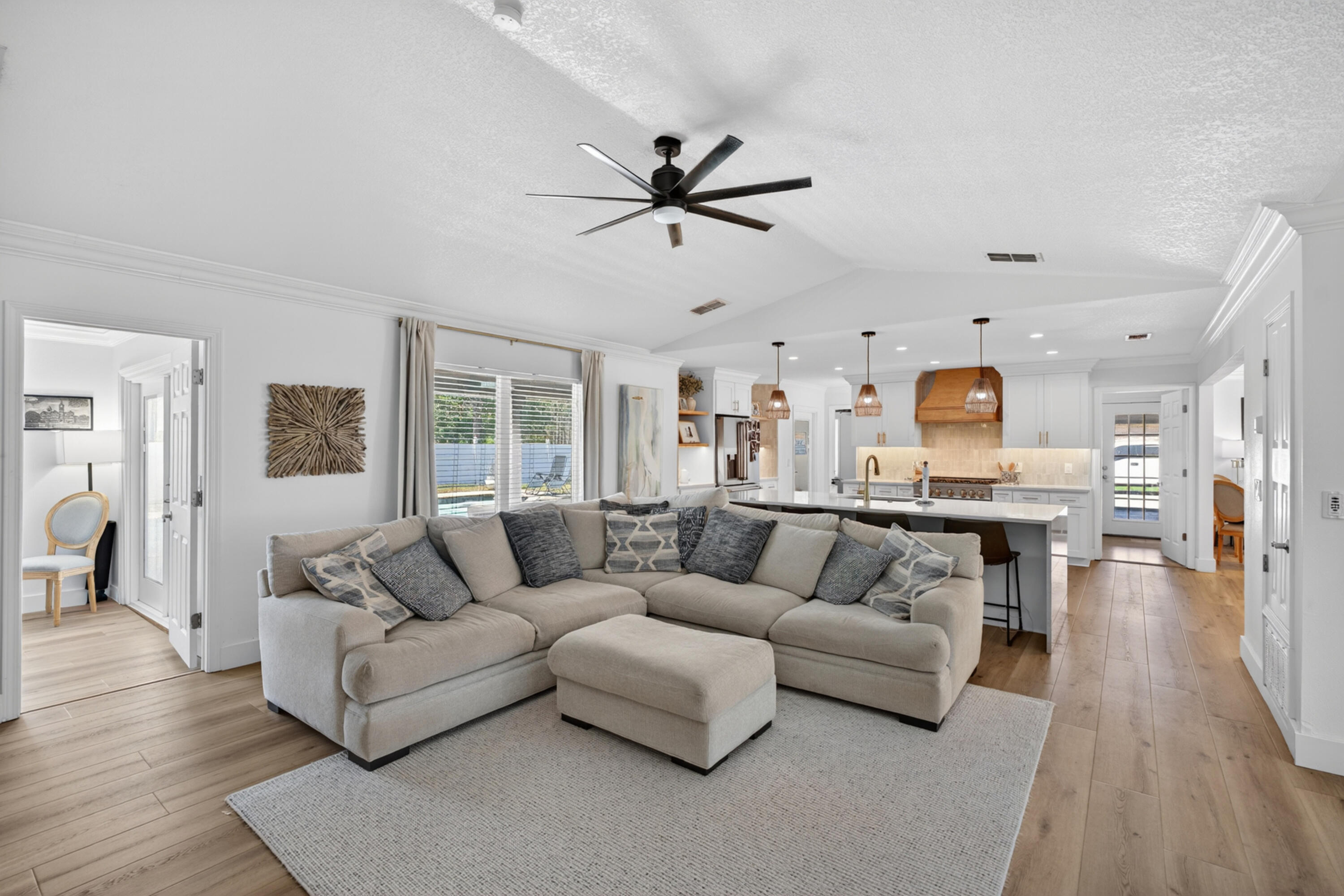 209 Santa Barbara Avenue Santa Rosa Beach, FL 32459 - Photo 10 of 78 a living room with furniture and a wooden floor