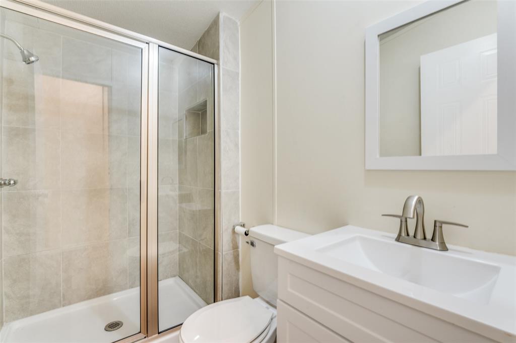 312 Oak Street Blue Ridge, TX 75424 - Photo 15 of 20 a bathroom with a sink a toilet and shower