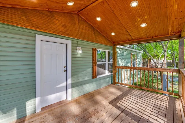 a kitchen with cabinets appliances a sink and a window
