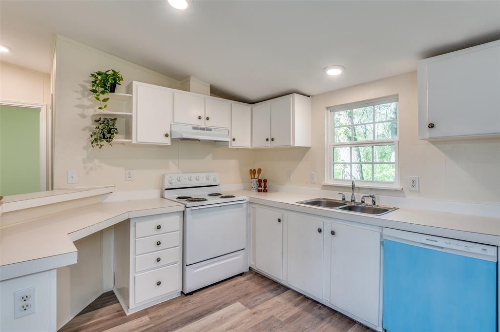 312 Oak Street Blue Ridge, TX 75424 - Photo 3 of 20 a kitchen with cabinets appliances a sink and a window