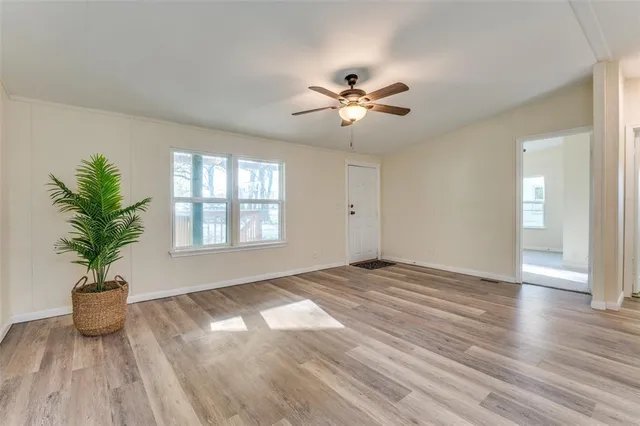 a view of a kitchen with a sink and a chandelier