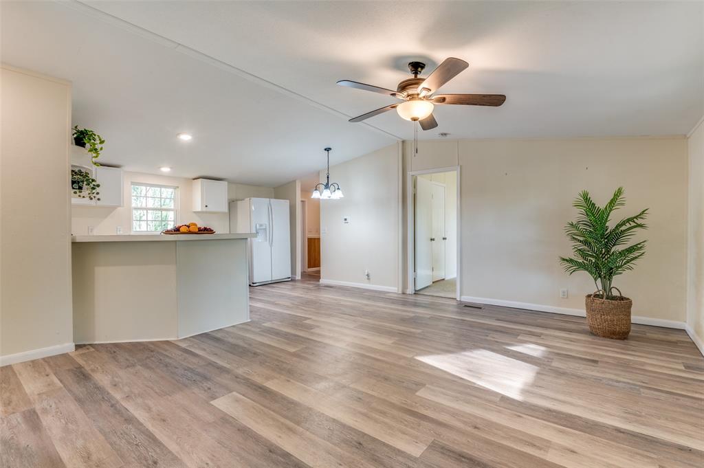 312 Oak Street Blue Ridge, TX 75424 - Photo 6 of 20 a view of a kitchen with a sink and a chandelier