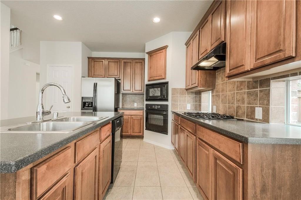 2338 Falcon Point Drive Frisco, TX 75033 - Photo 10 of 17 kitchen with wall oven, gas cooktop and refrigerator