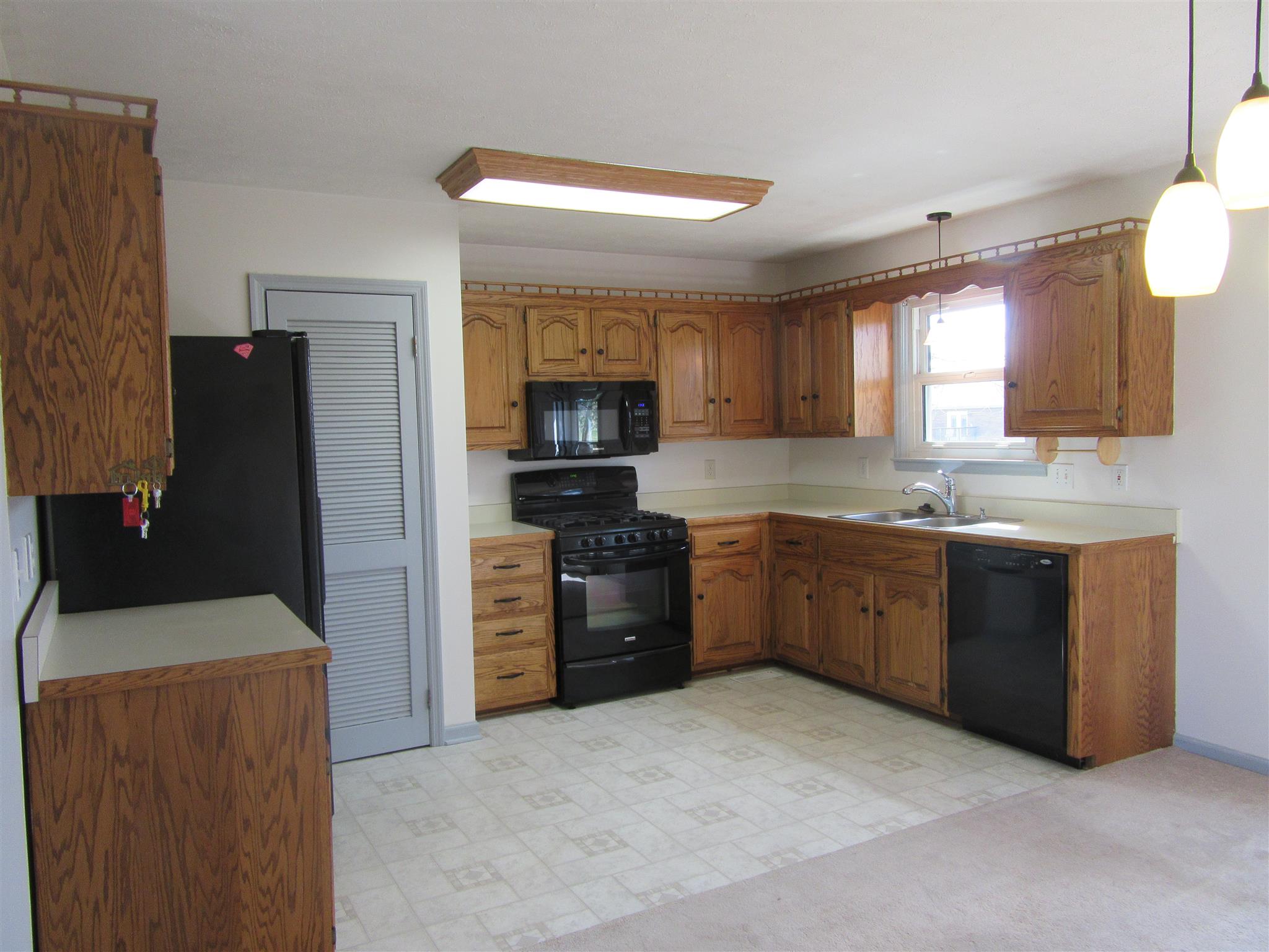 6049 Ebenezer Road Greenbrier, TN 37073 - Photo 7 of 29 a kitchen with a refrigerator stove and sink