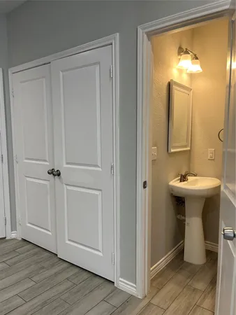 a bathroom with a sink and mirror