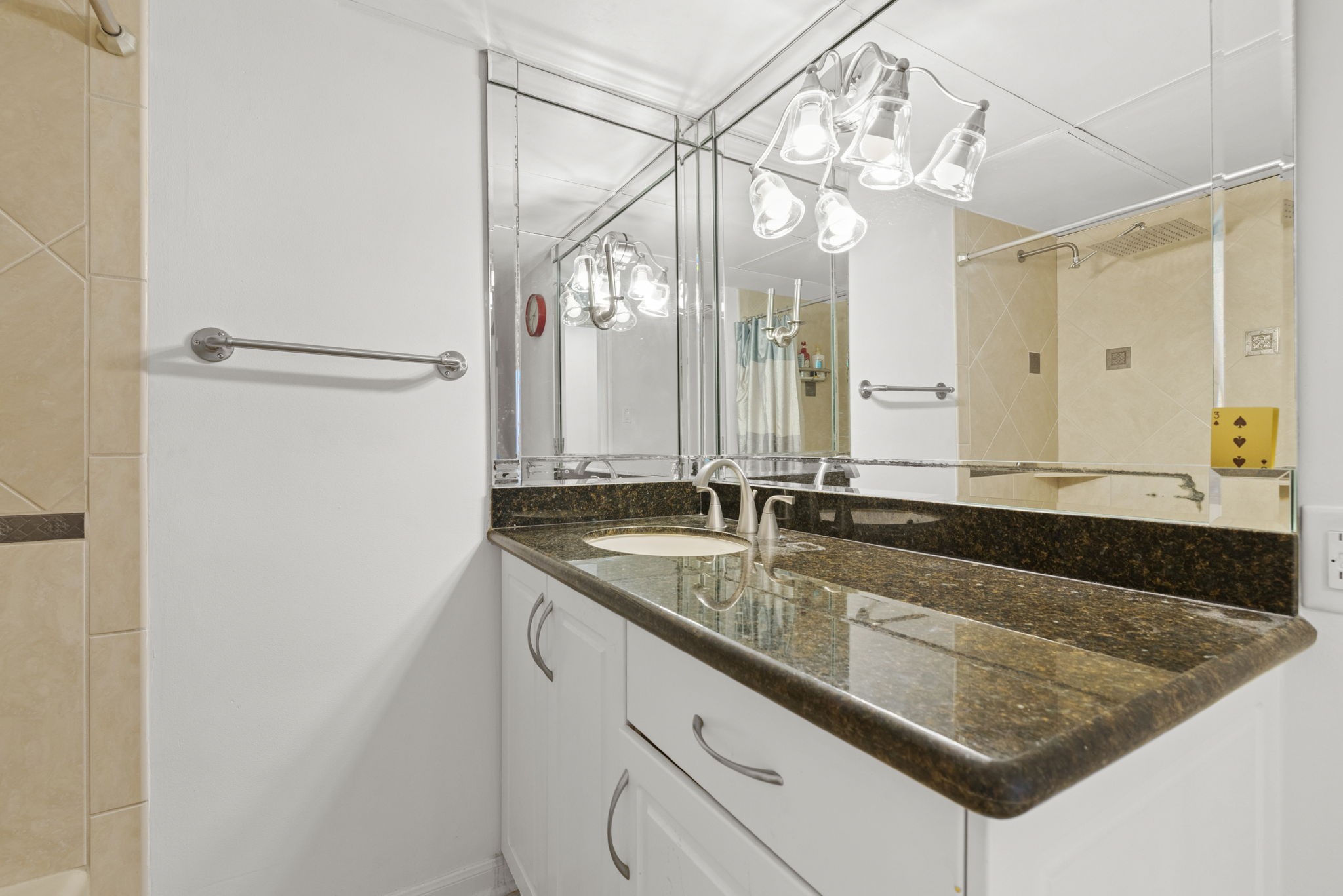 3350 McCue Road, Unit 1901 Houston, TX 77056 - Photo 12 of 29 a bathroom with a granite countertop sink and a mirror