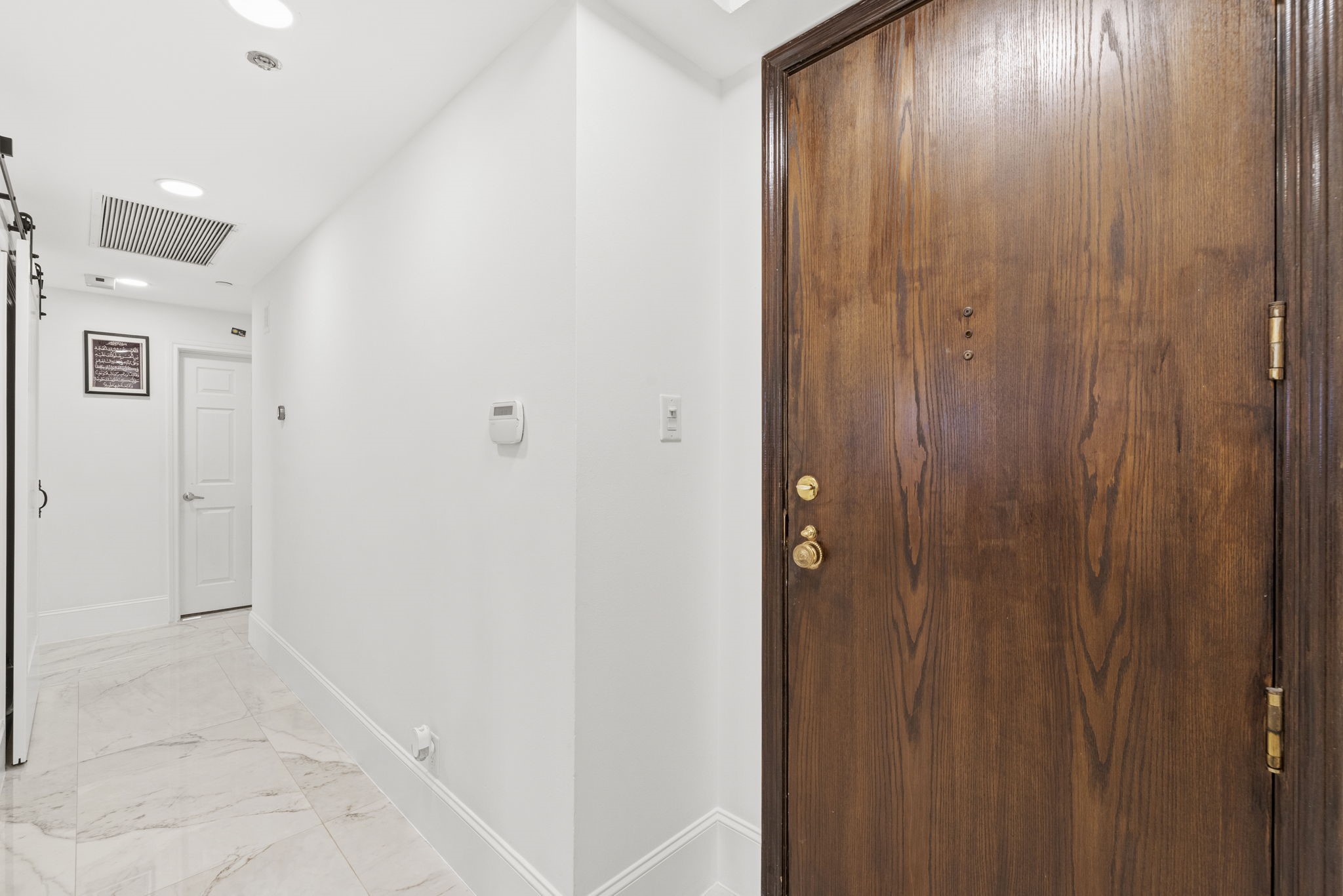 3350 McCue Road, Unit 1901 Houston, TX 77056 - Photo 3 of 29 a view of a hallway with wooden floor