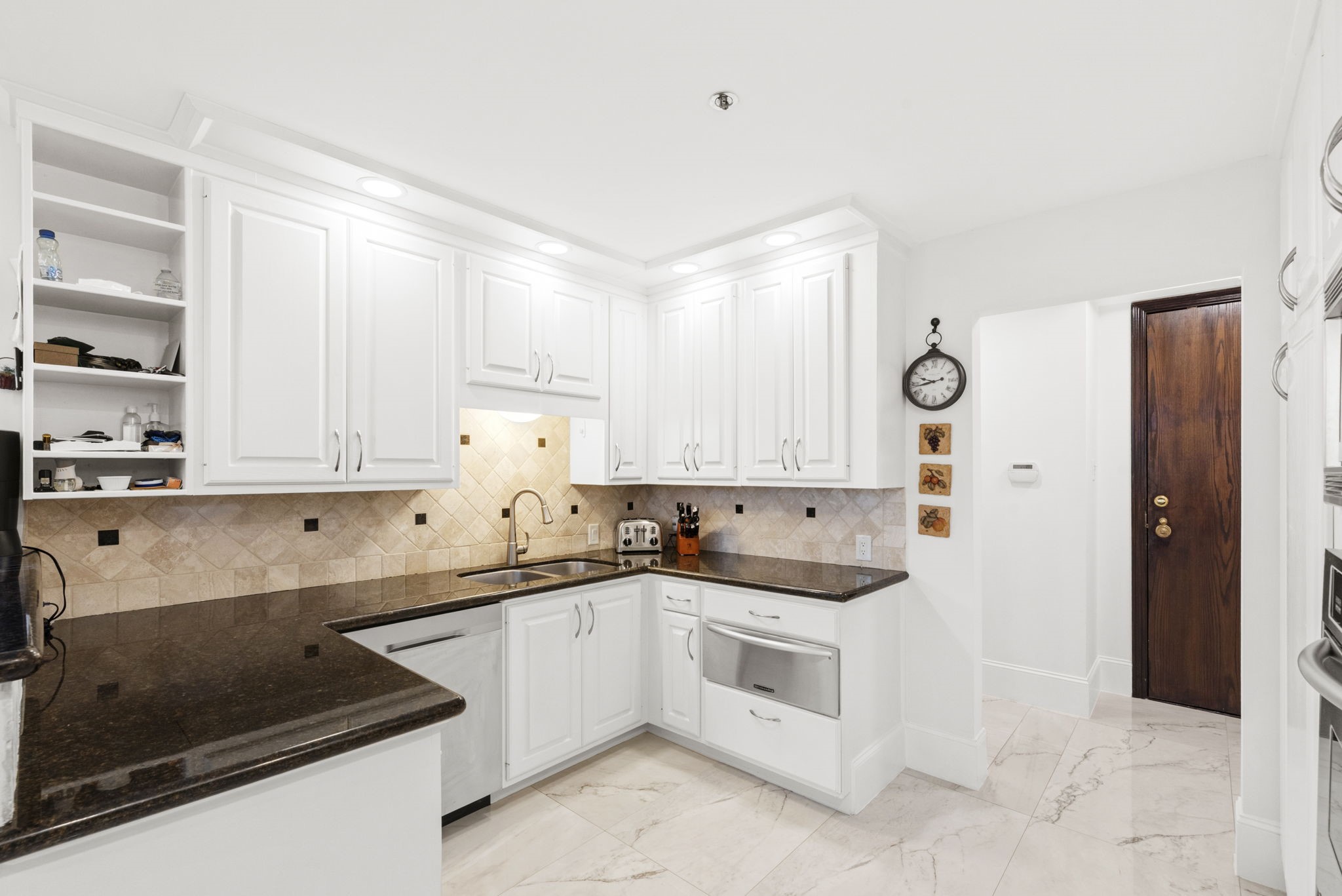 3350 McCue Road, Unit 1901 Houston, TX 77056 - Photo 4 of 29 a kitchen with granite countertop white cabinets and white appliances